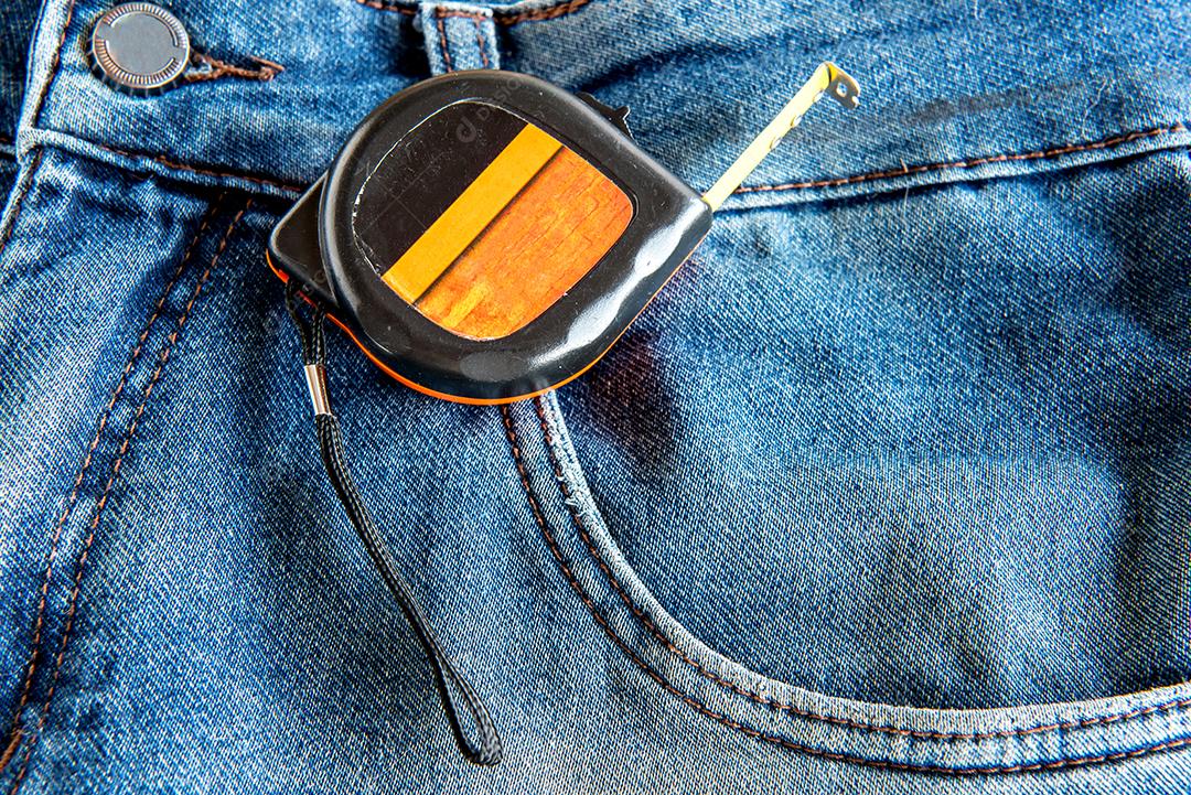 Measuring tool in jeans pocket.