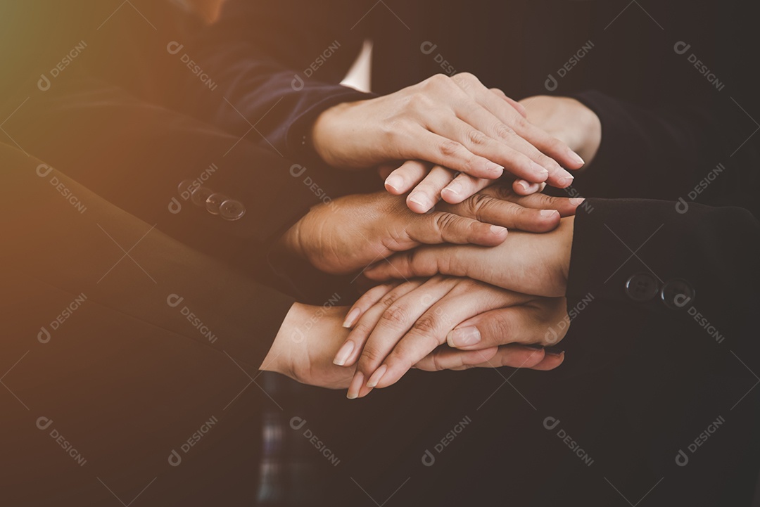 Business people making stack of hands for new startup project.