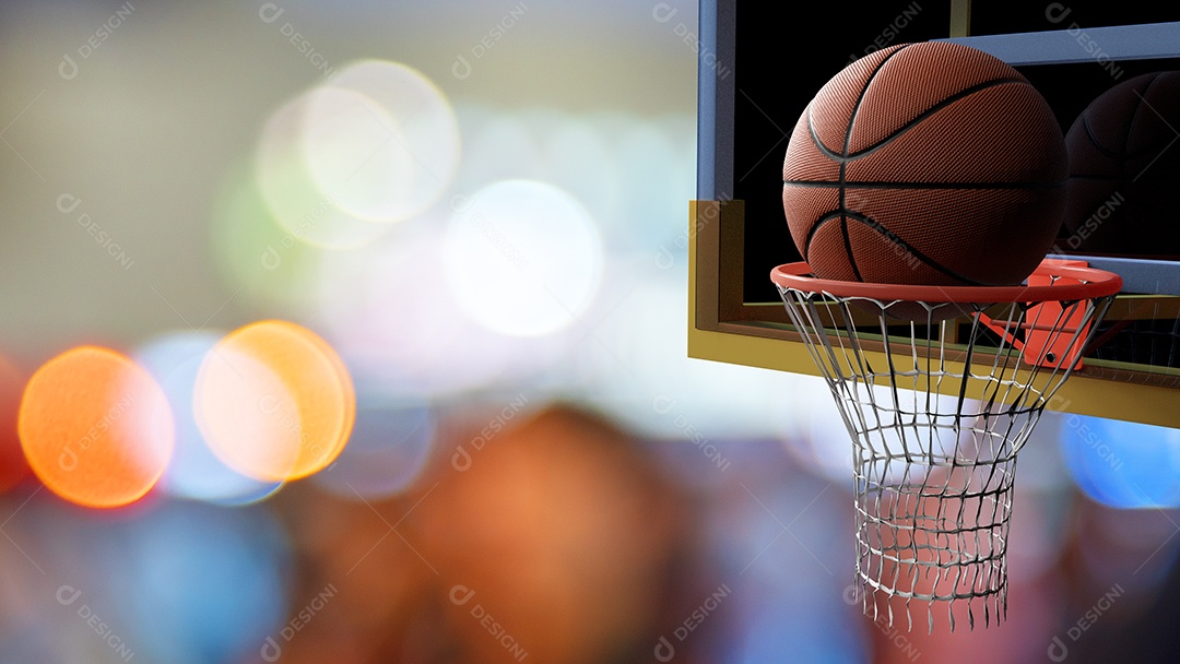 Basketball entering the basket in beautiful colorful stadium bokeh.