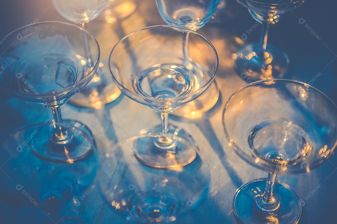 Row of wine glass on table in nightclub bar and pub restaurant. Cups and drinks concept.