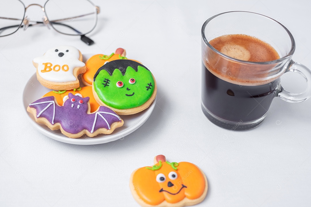 Hot espresso or chocolate cup with funny Halloween cookies. Happy Halloween Day, Trick or Threat, Hello October, Fall Autumn, Traditional, Party and Holiday Concept