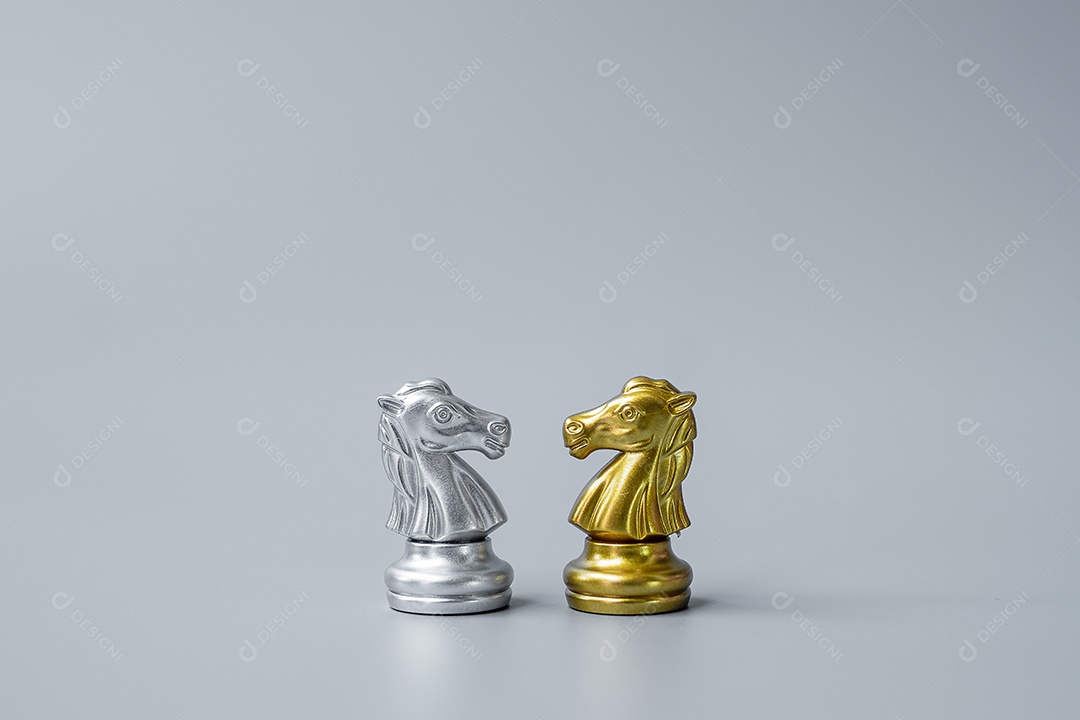 Gold and Silver Chess Knight (Knight) Figure on Chessboard