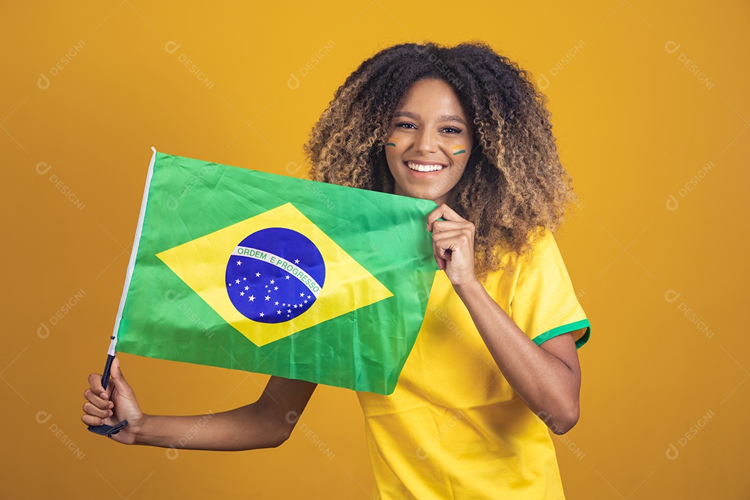 Afro-Brazilian woman holding the flag of Brazil