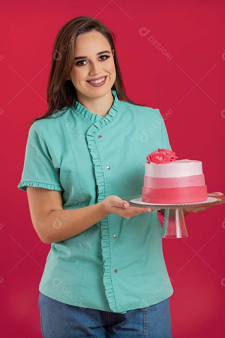 Beautiful woman holding decorated cake