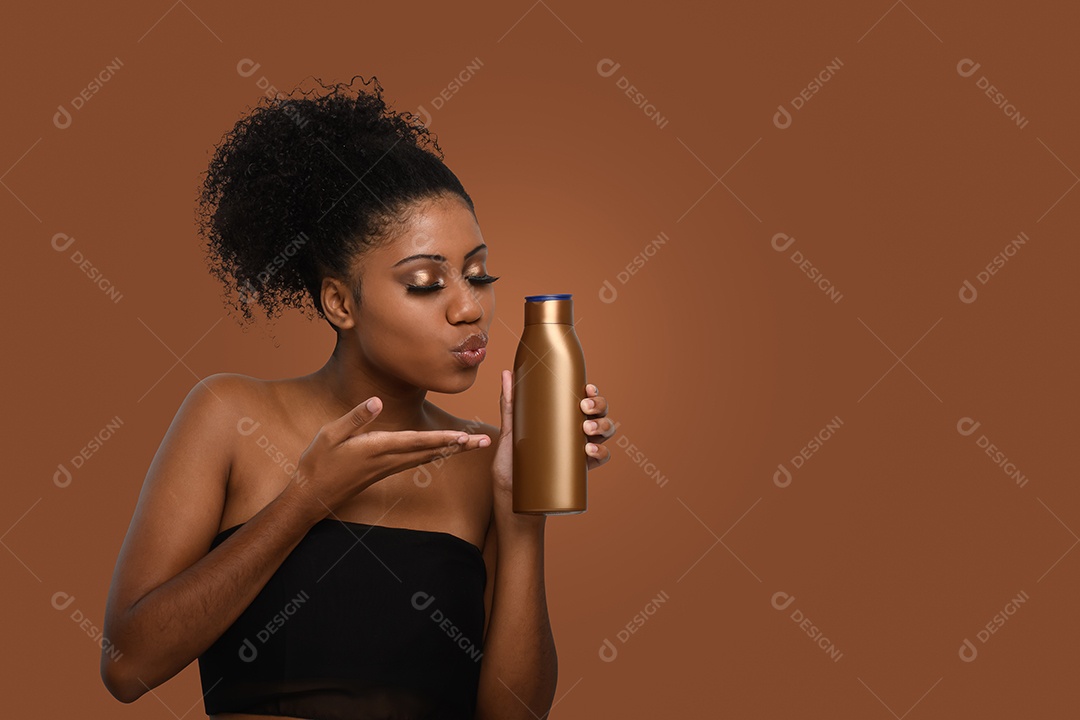 Young brunette with moisturizing cream pot in the hands