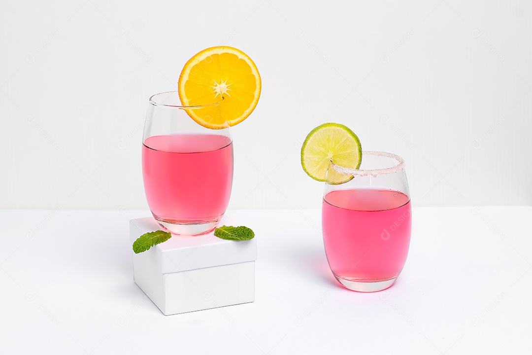 Pink and orange cocktails on the edge