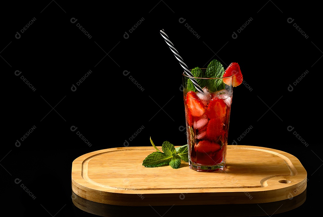 Glass with strawberry and mint drink