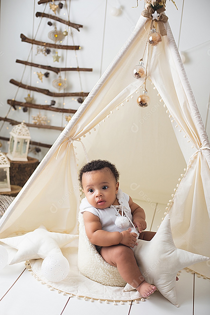 A beautiful baby in the Christmas decoration touch