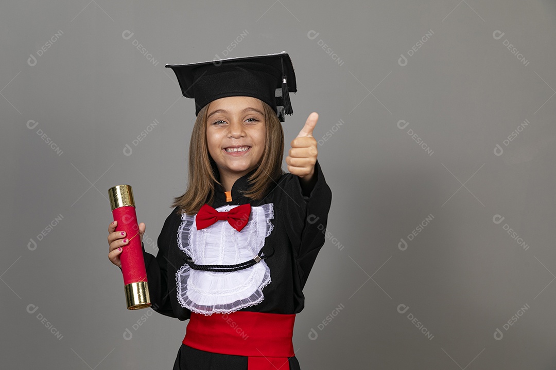 Beautiful cute girl using beca and holding diploma straw