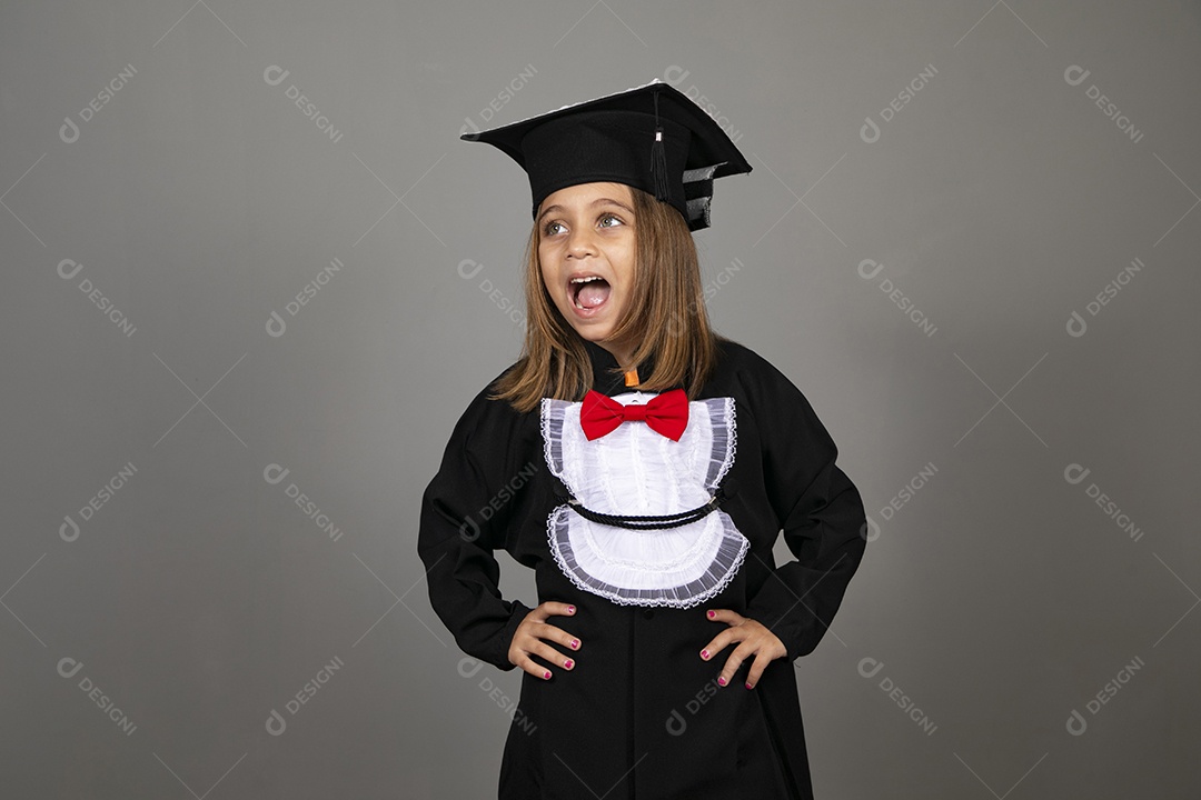 A beautiful little girl with graduation clothes