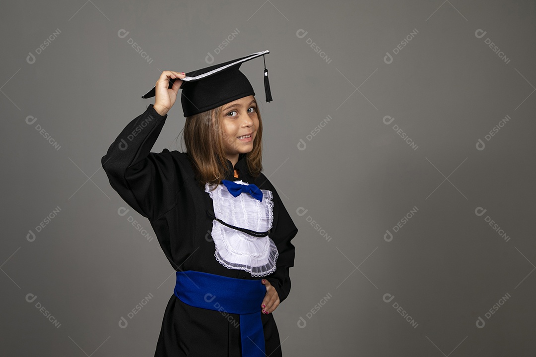 A beautiful little girl with graduation clothes