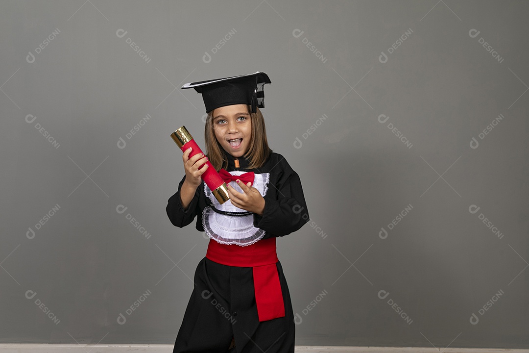 Cheerful girl hanging diploma straw on her hands