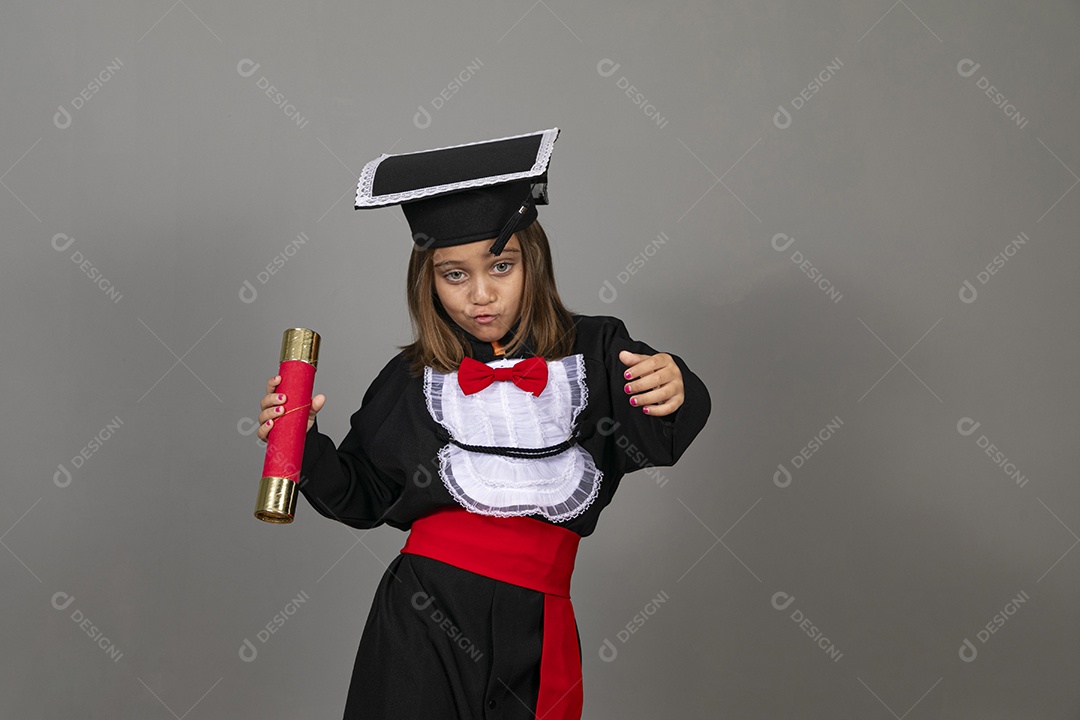 Beautiful little girl doing graduation pose