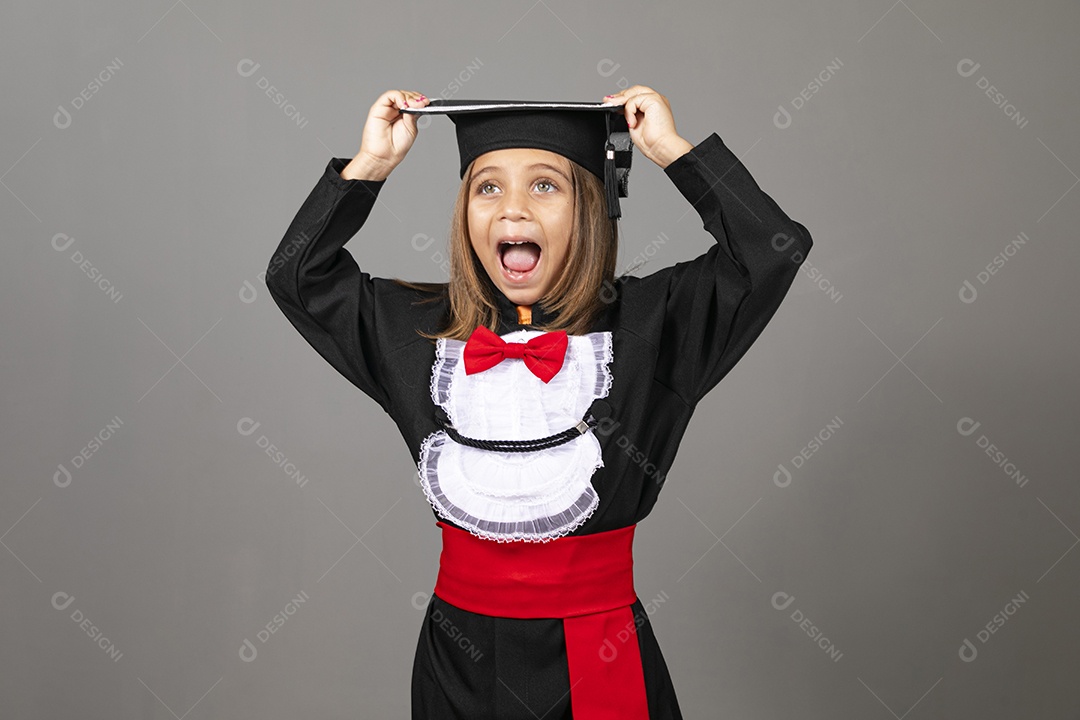 Beautiful happy little girl in graduation