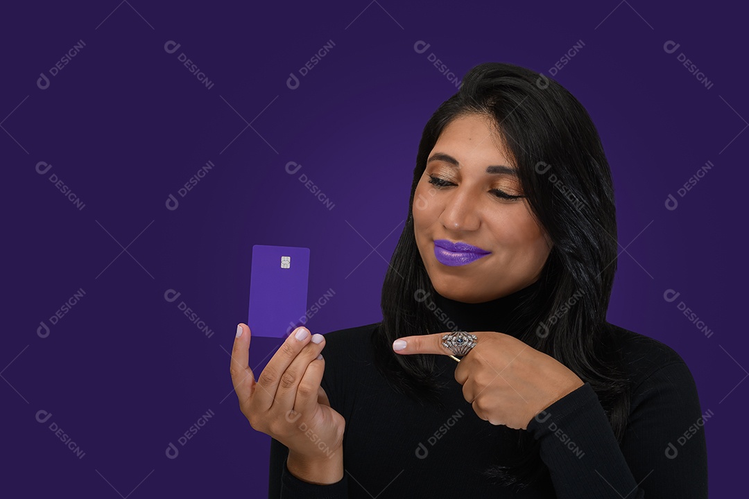 Beautiful woman pointing to credit card ns hands